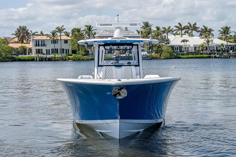 Slide: The Image of 2023 Sportsman Open 352 Center Console boat on water, front view. - 2