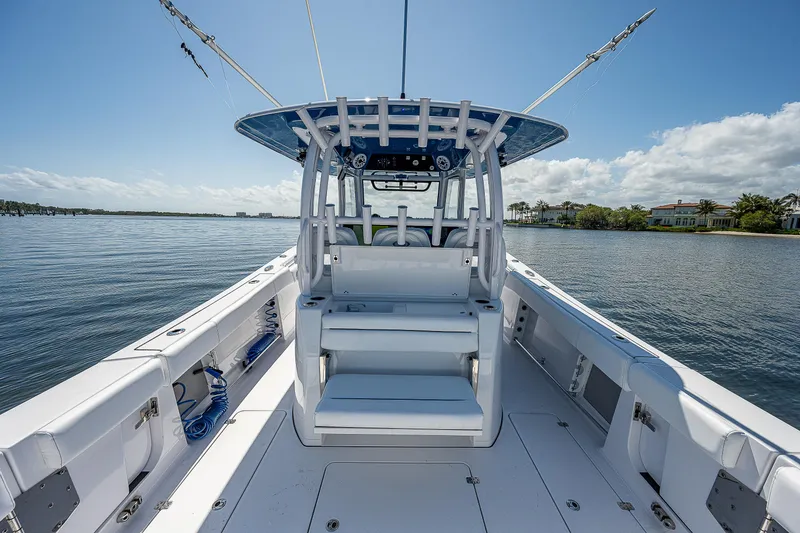 Slide: The Image of 2023 Sportsman Open 352 Center Console boat on calm water. - 20