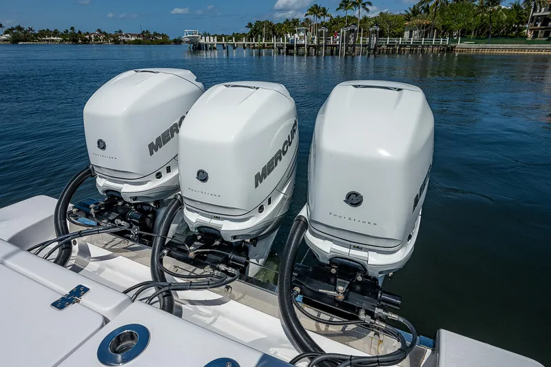 Slide: The Image of Triple Mercury outboard engines on a 2023 Sportsman Open 352 Center Console boat. - 26