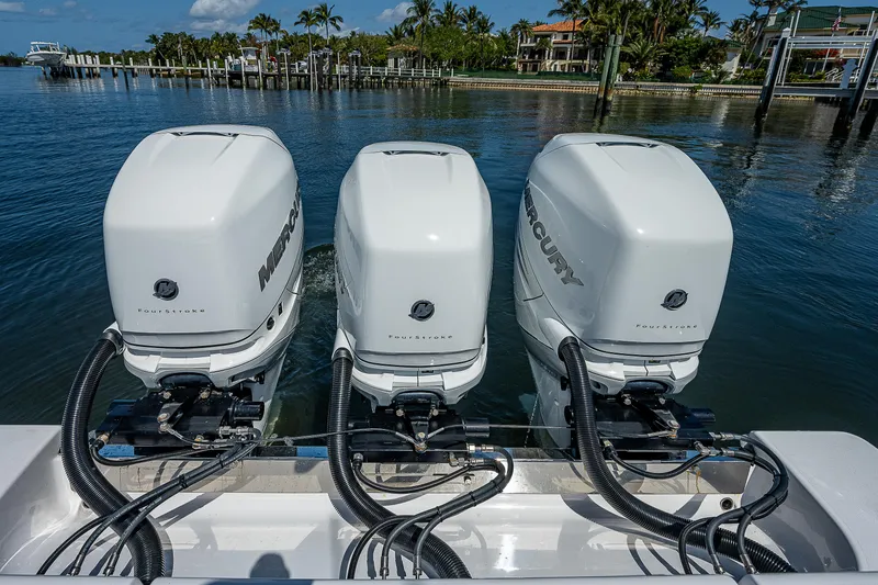 Slide: The Image of 2023 Sportsman Open 352 Center Console with triple Mercury outboard engines. - 27