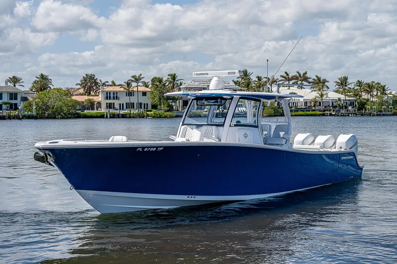 Slide: The Image of 2023 Sportsman Open 352 Center Console boat on calm water. - 29