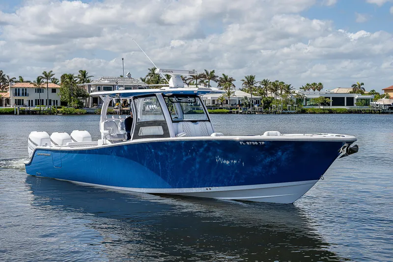 Slide: The Image of 2023 Sportsman Open 352 Center Console boat cruising on a sunny day. - 30