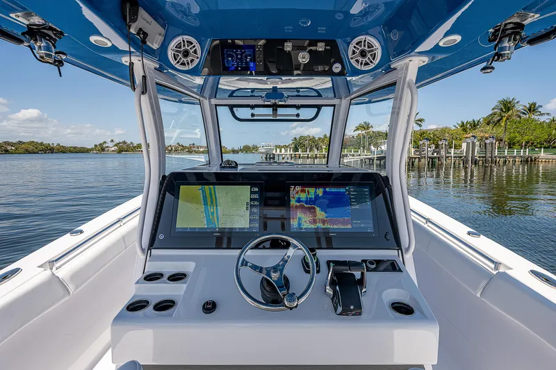 Slide: The Image of 2023 Sportsman Open 352 Center Console boat helm with advanced navigation displays. - 9