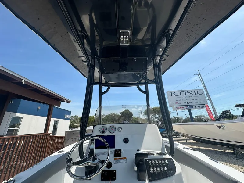 Slide: The Image of 2024 NauticStar 222 OSL boat dashboard and controls. - 12