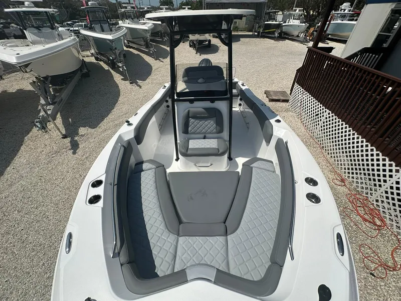 Slide: The Image of 2024 NauticStar 222 OSL boat with spacious seating and modern design. - 2