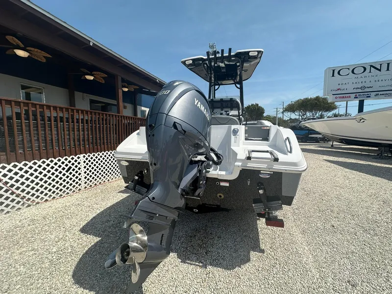 Slide: The Image of 2024 NauticStar 222 OSL boat with Yamaha outboard motor, displayed outdoors. - 21