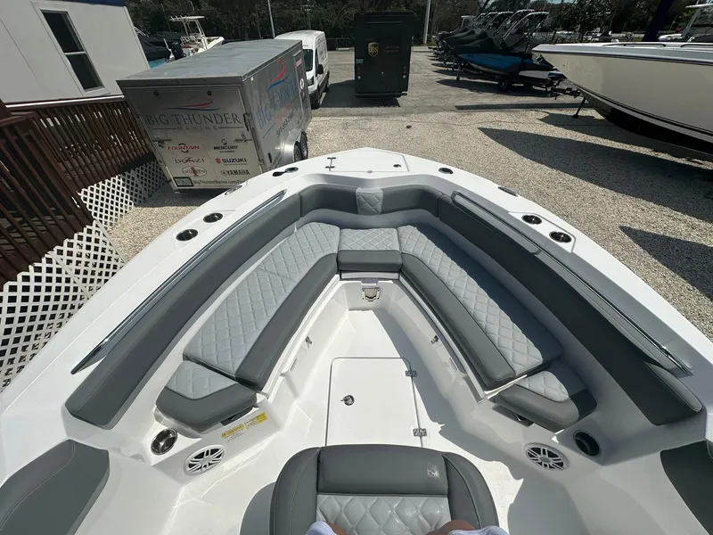 Slide: The Image of 2024 NauticStar 222 OSL boat with spacious seating and modern design. - 5