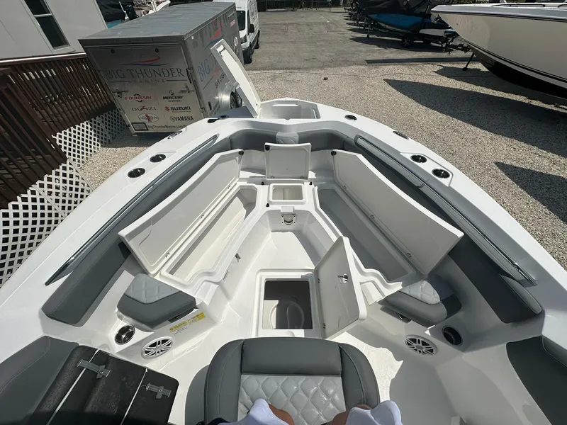 Slide: The Image of 2024 NauticStar 222 OSL boat interior with open storage compartments. - 7