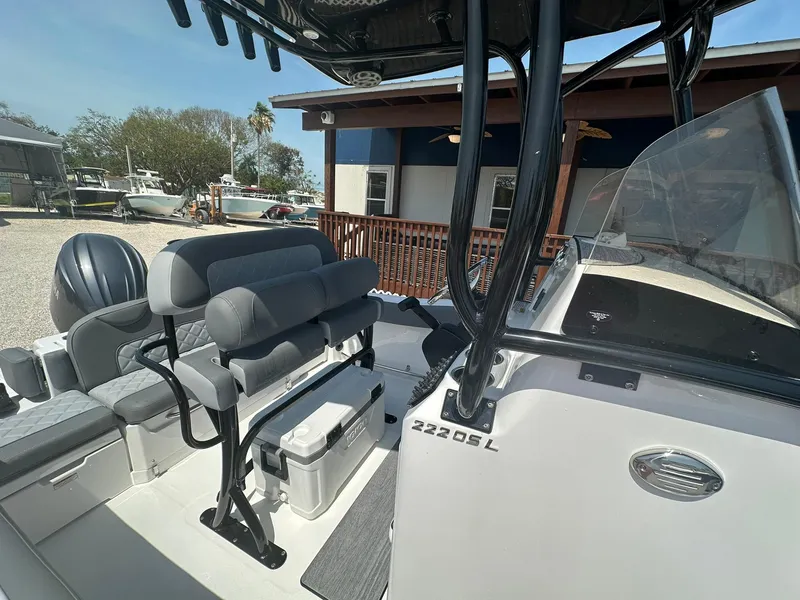 Slide: The Image of 2024 NauticStar 222 OSL boat interior with seating and console. - 9