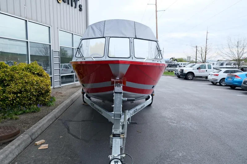 Slide: The Image of 2024 KingFisher 1825 Falcon boat on trailer, parked outside dealership. - 3