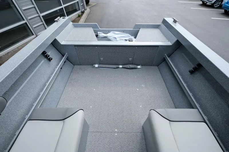 Slide: The Image of 2024 KingFisher 1825 Falcon boat interior with spacious seating and storage. - 6