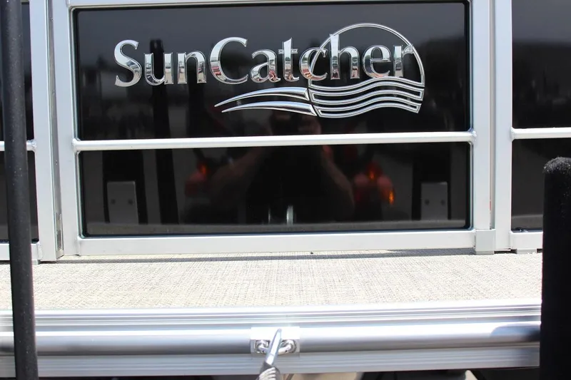 Slide: The Image of 2023 SunCatcher Fusion 324 RC boat logo on rear deck. - 11