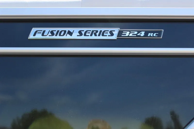 Slide: The Image of 2023 SunCatcher Fusion 324 RC logo on boat exterior. - 3