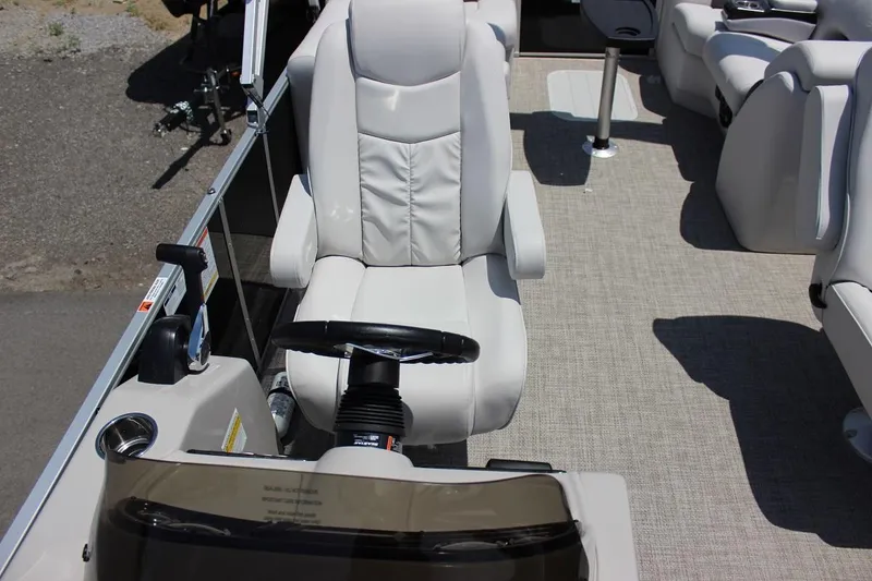 Slide: The Image of Captain's chair and helm of 2023 SunCatcher Fusion 324 RC pontoon boat. - 7