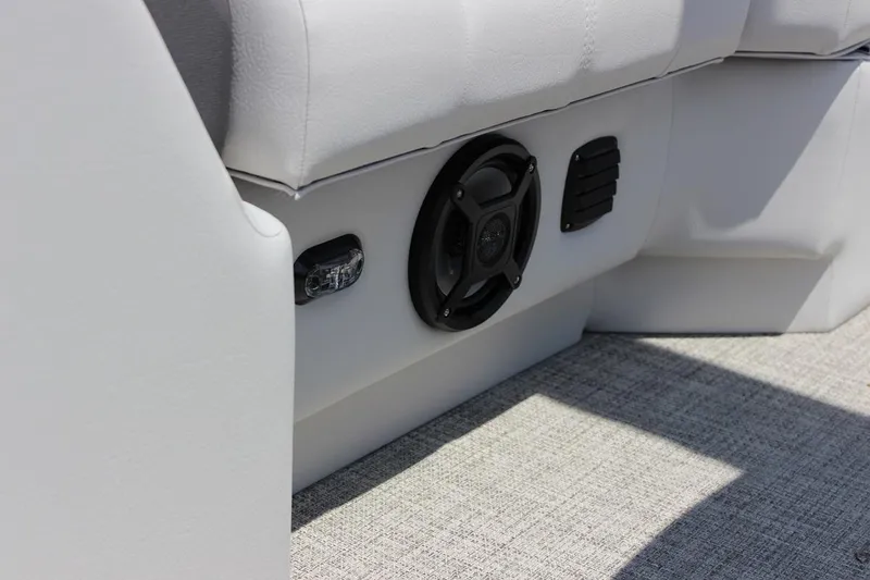 Slide: The Image of Close-up of the 2023 SunCatcher Fusion 324 RC boat's interior speaker and seating. - 9