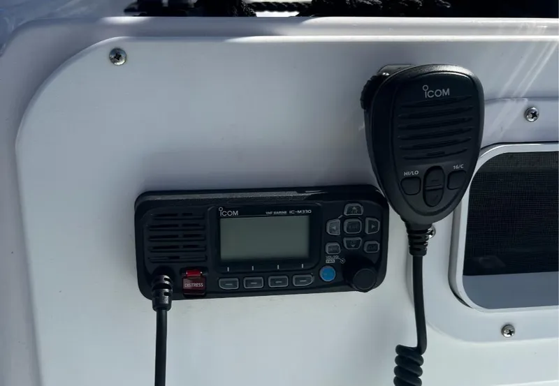 Slide: The Image of ICOM marine radio installed on a 1980 Mako 23 boat dashboard. - 9