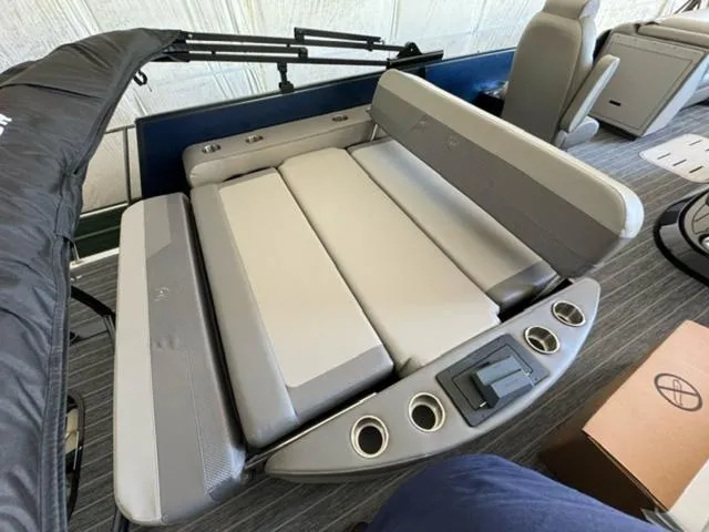 Slide: The Image of 2024 Premier 250 Solaris RL boat interior with adjustable seating and cup holders. - 11