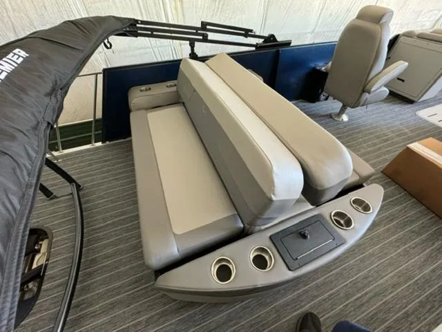 Slide: The Image of 2024 Premier 250 Solaris RL boat interior with gray seating and cup holders. - 12