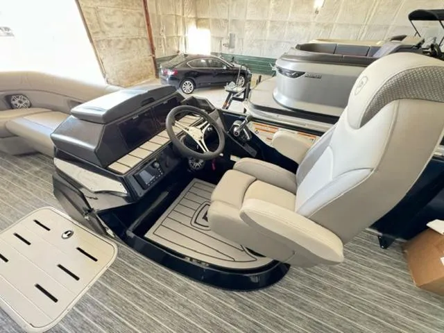 Slide: The Image of 2024 Premier 250 Solaris RL boat interior with captain's chair and control console. - 13