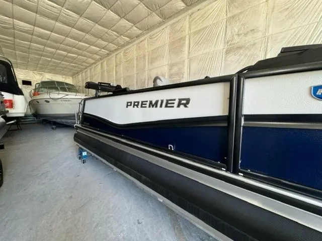 Slide: The Image of 2024 Premier 250 Solaris RL pontoon boat in storage facility. - 3