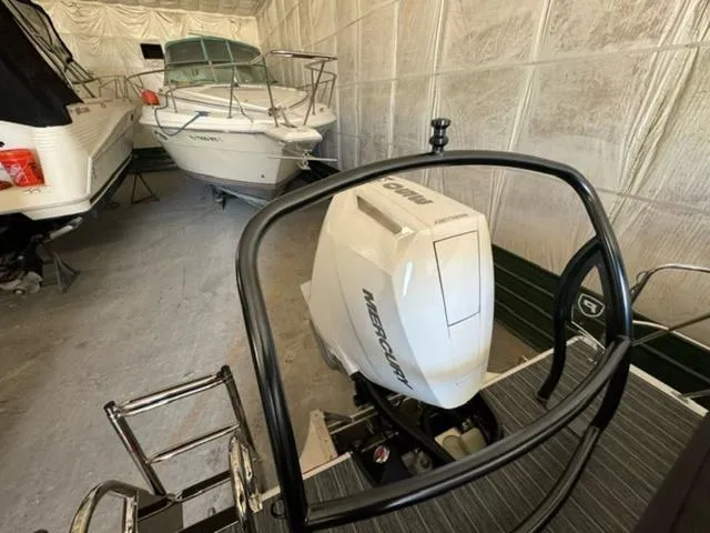Slide: The Image of 2024 Premier 250 Solaris RL with Mercury outboard engine in storage. - 6
