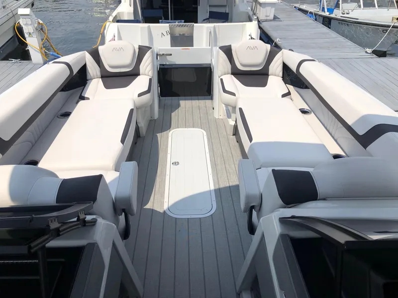 Slide: The Image of 2024 Avalon Excalibur 27' boat interior with luxurious seating and modern design. - 11