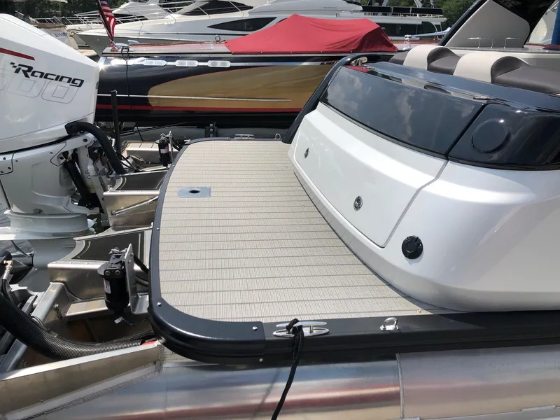 Slide: The Image of 2024 Avalon Excalibur 27' boat rear deck and engine at marina. - 5