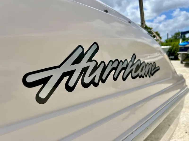 Slide: The Image of Close-up of 2002 Hurricane 194 boat model logo on white hull. - 13