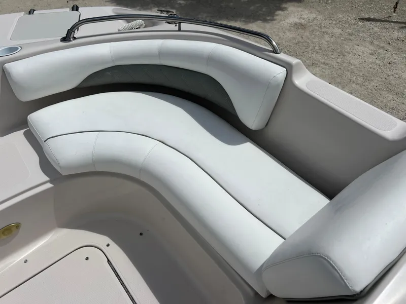 Slide: The Image of White cushioned seating on a 2002 Hurricane 194 boat. - 18
