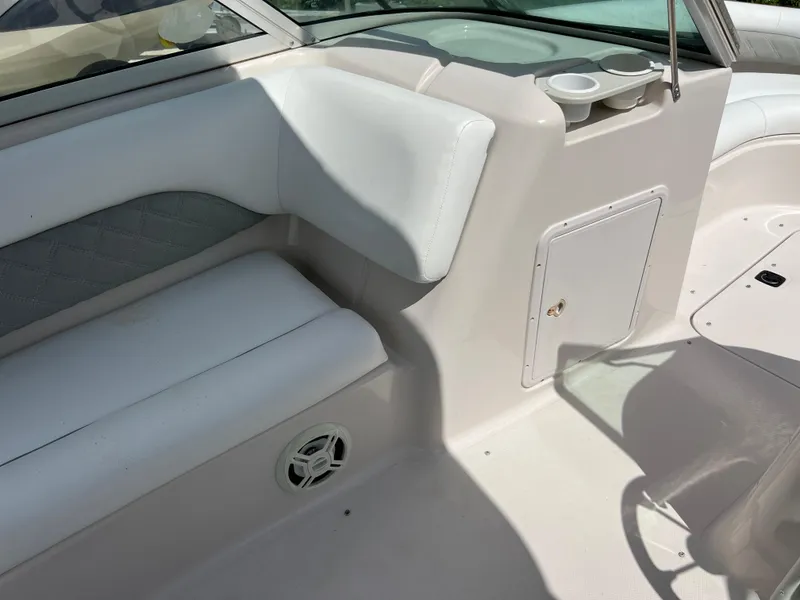 Slide: The Image of Interior seating of a 2002 Hurricane 194 boat with white upholstery. - 19
