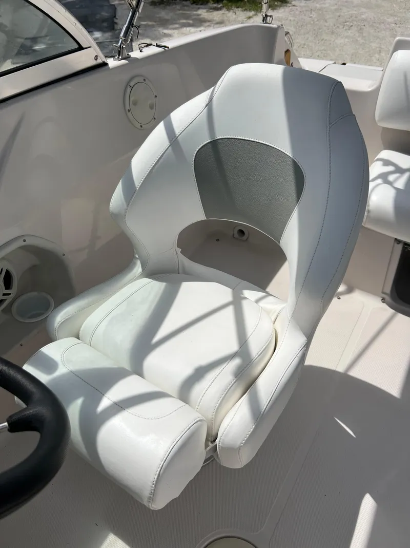 Slide: The Image of Captain's chair on a 2002 Hurricane 194 boat. - 20