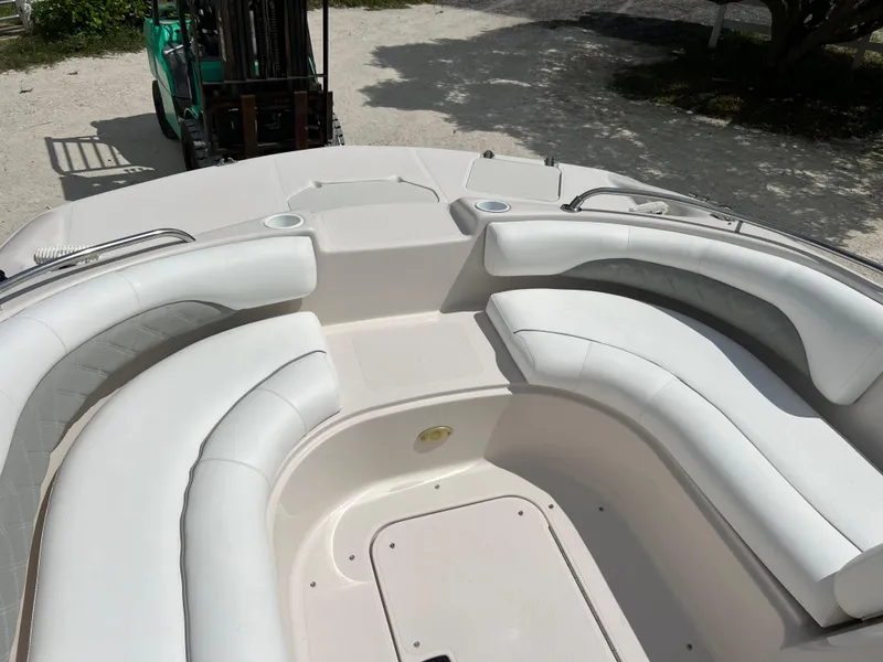 Slide: The Image of Spacious seating area on a 2002 Hurricane 194 boat with white upholstery. - 22