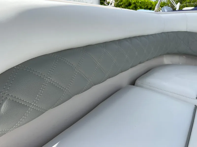 Slide: The Image of Close-up of 2002 Hurricane 194 boat's white and gray quilted leather seating. - 23