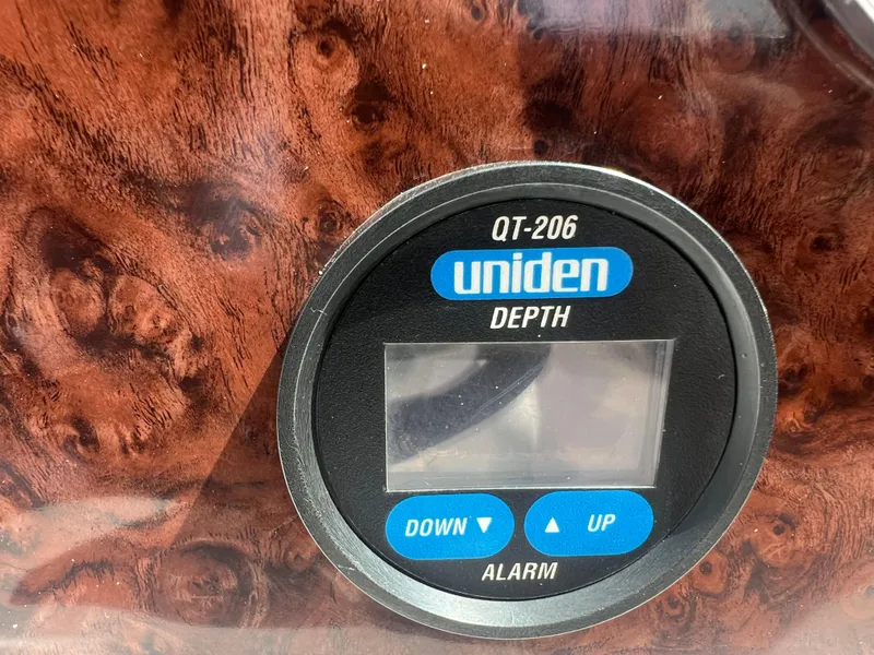 Slide: The Image of Uniden QT-206 depth gauge on a 2002 Hurricane 194 boat dashboard. - 27