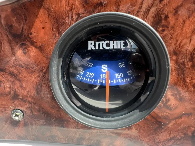 Slide: The Image of Ritchie compass on a 2002 Hurricane 194 boat dashboard. - 28