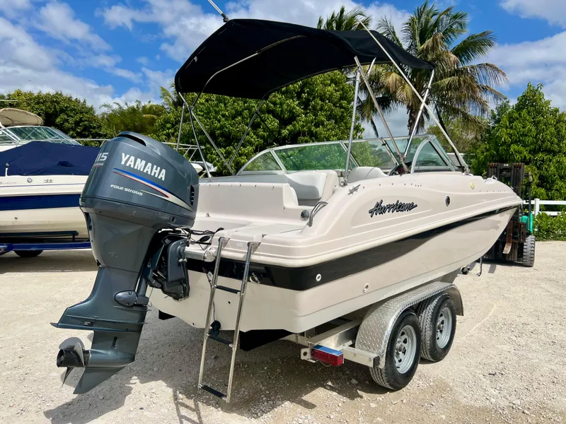 Slide: The Image of Hurricane 194 boat (2002 model) with Yamaha outboard motor on trailer. - 30