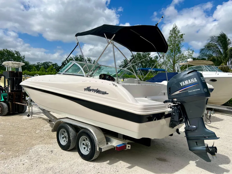 Slide: The Image of 2002 Hurricane 194 boat with Yamaha outboard motor on trailer. - 31