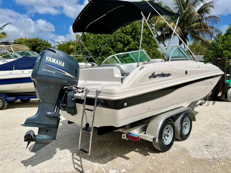 Slide: The Image of 2002 Hurricane 194 boat with Yamaha outboard motor on trailer. - 36