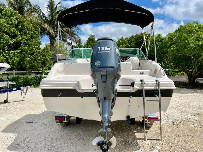Slide: The Image of 2002 Hurricane 194 boat with 115 horsepower outboard motor and canopy. - 38