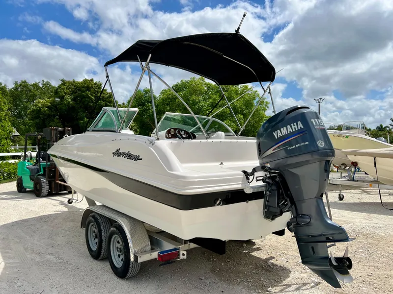 Slide: The Image of 2002 Hurricane 194 boat with Yamaha outboard motor on trailer. - 39