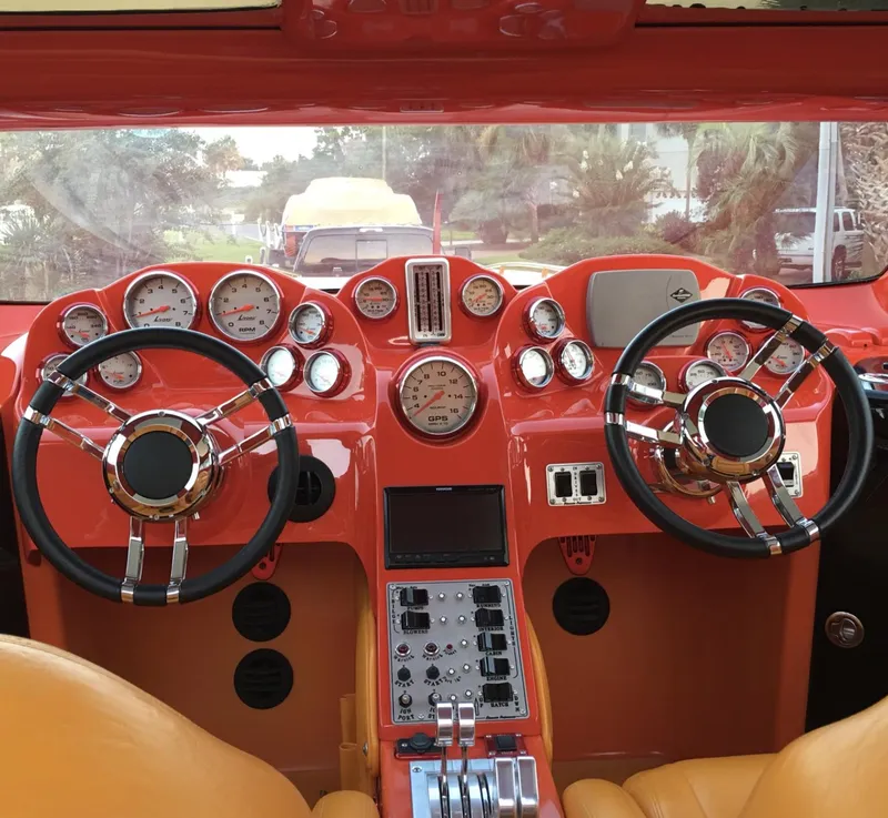 Slide: The Image of 2007 Eliminator 36 Daytona Coupe dashboard with dual steering wheels and multiple gauges. - 2