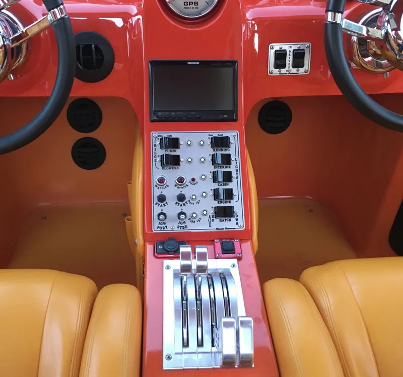 Slide: The Image of 2007 Eliminator 36 Daytona Coupe dashboard with controls, GPS, and dual steering wheels. - 3