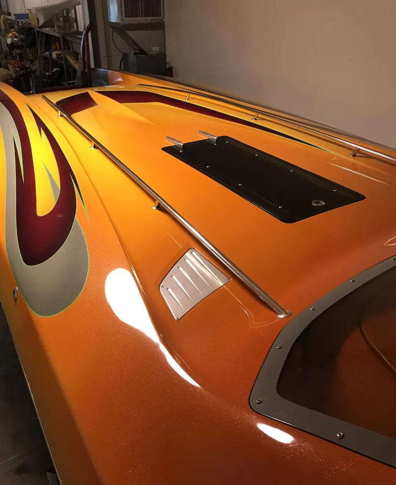 Slide: The Image of 2007 Eliminator 36 Daytona Coupe, orange with custom flame design. - 5