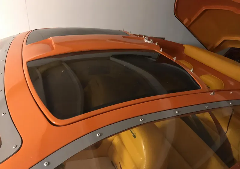 Slide: The Image of 2007 Eliminator 36 Daytona Coupe, orange and yellow interior, close-up of cockpit. - 6
