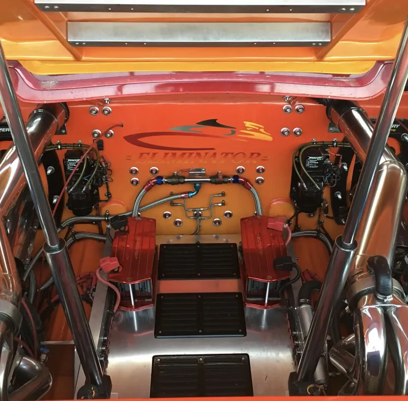 Slide: The Image of 2007 Eliminator 36 Daytona Coupe engine bay with vibrant orange detailing. - 8