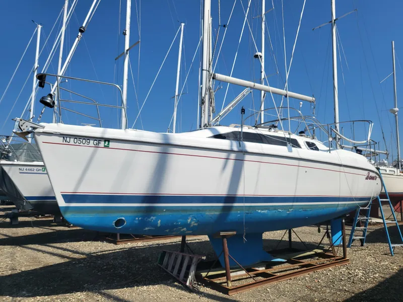 Slide: The Image of 1998 Hunter 280 sailboat on a dry dock. - 11