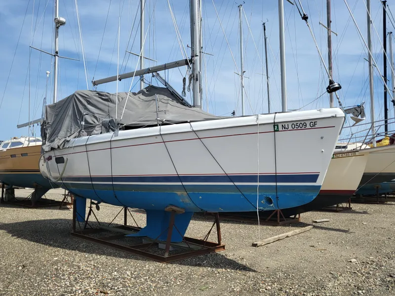 Slide: The Image of 1998 Hunter 280 sailboat on a dry dock. - 12