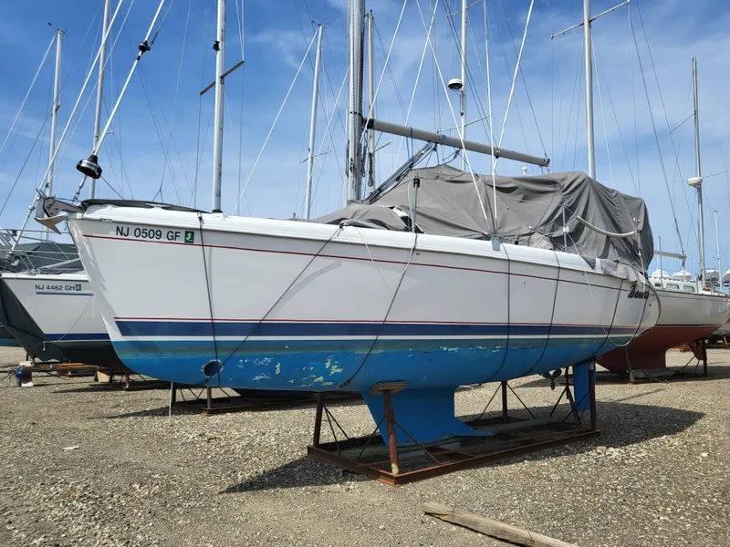 Slide: The Image of 1998 Hunter 280 sailboat on a dry dock. - 14