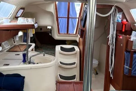 Slide: The Image of Interior of a 1998 Hunter 280 yacht with kitchen and stairs. - 4