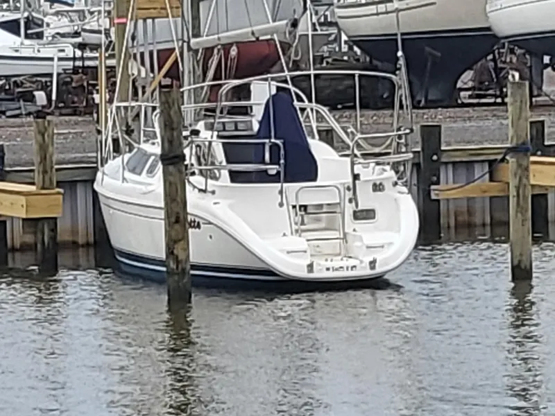 Slide: The Image of 1998 Hunter 280 sailboat docked in marina. - 5